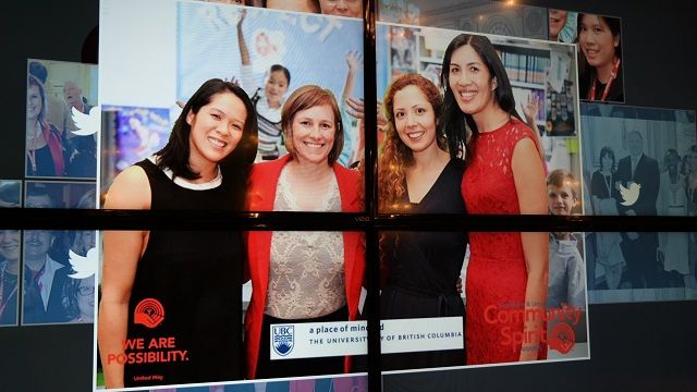 Photo of four women projected on a big screen via SnapCast