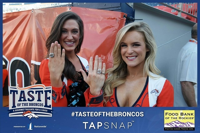 Denver Broncos cheerleaders showing off their team rings