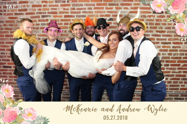 bride and groomsmen posing